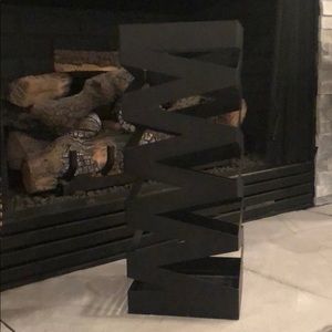 Black metal home accent piece.